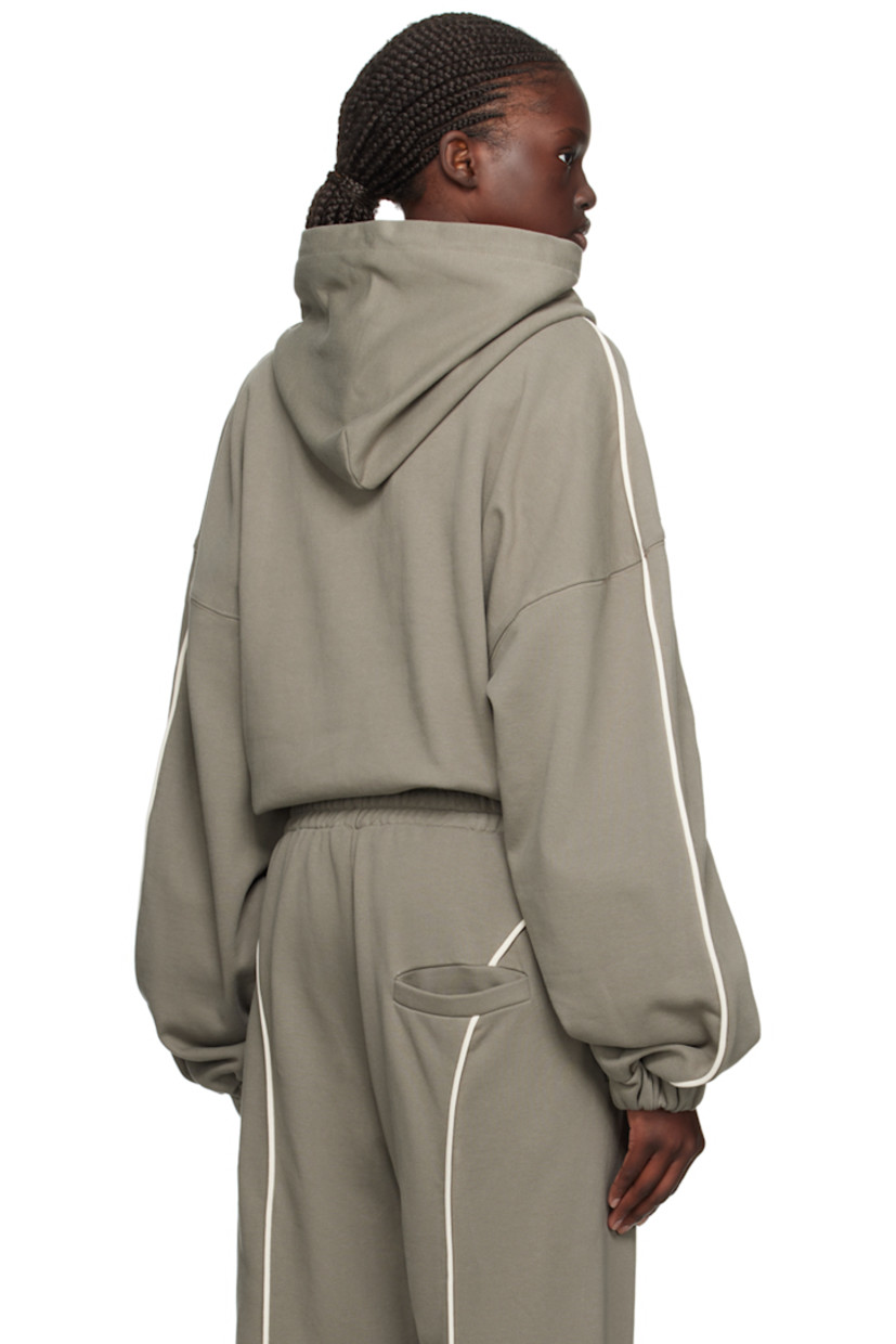 French terry hoodie.

· Drawstring at hood
· Kangaroo pocket
· Elasticized cropped hem and cuffs
· Piping at sleeves
· Dropped shoulders

Supplier color: Sage