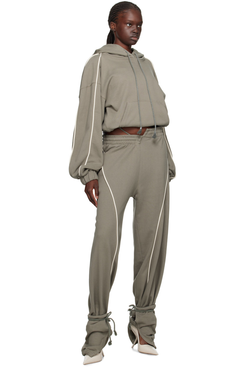 French terry hoodie.

· Drawstring at hood
· Kangaroo pocket
· Elasticized cropped hem and cuffs
· Piping at sleeves
· Dropped shoulders

Supplier color: Sage