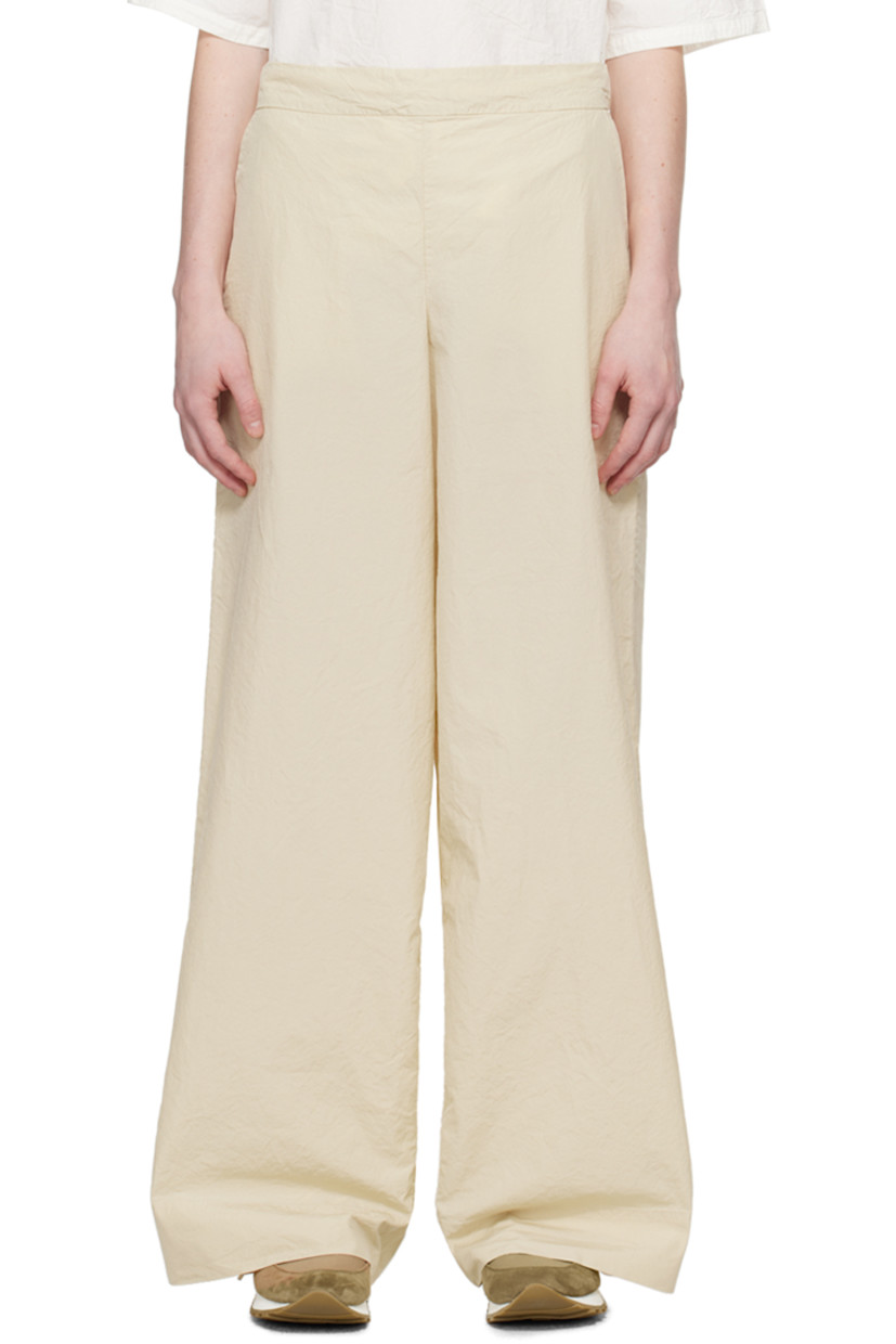 Crinkled cotton- and silk-blend poplin trousers.

· Concealed drawstring at partially elasticized waistband 
· Two-pocket styling
· Stitched detailing at back

Supplier color: Ecru