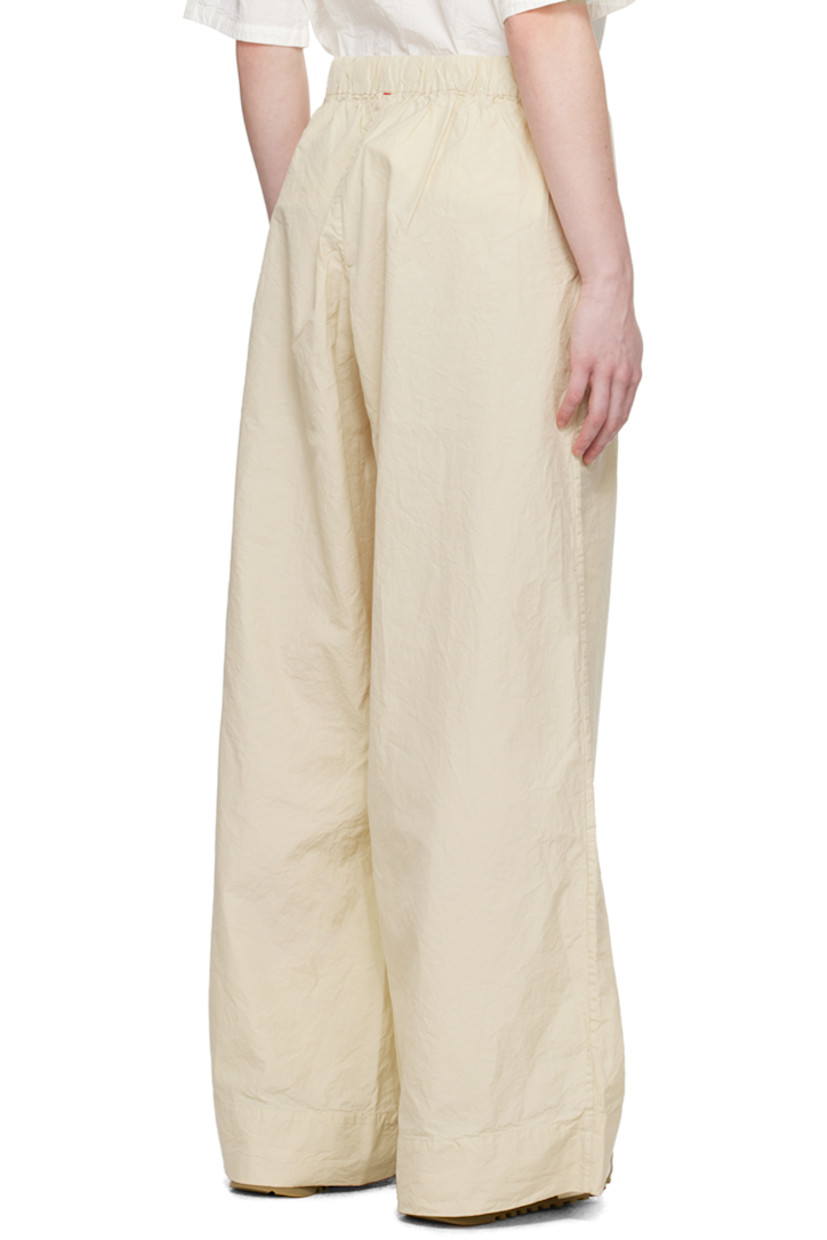 Crinkled cotton- and silk-blend poplin trousers.

· Concealed drawstring at partially elasticized waistband 
· Two-pocket styling
· Stitched detailing at back

Supplier color: Ecru