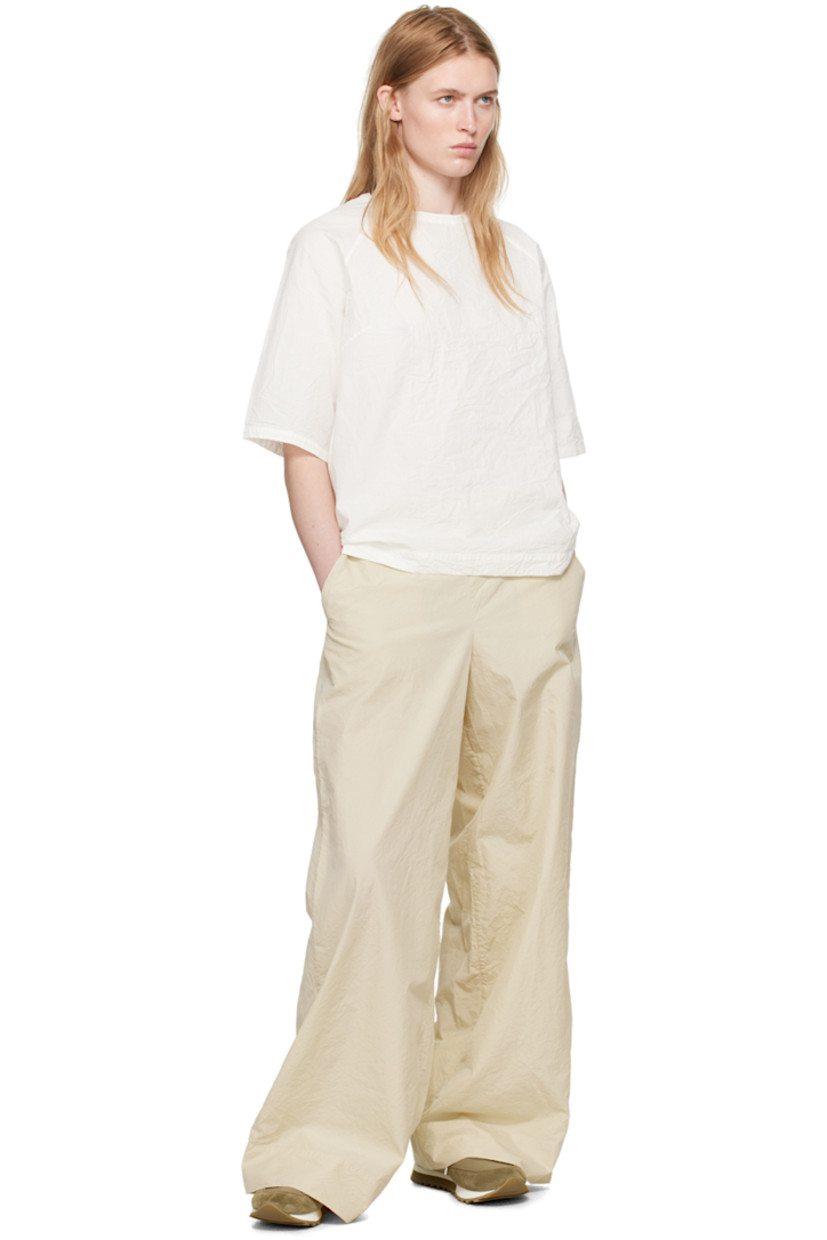 Crinkled cotton- and silk-blend poplin trousers.

· Concealed drawstring at partially elasticized waistband 
· Two-pocket styling
· Stitched detailing at back

Supplier color: Ecru