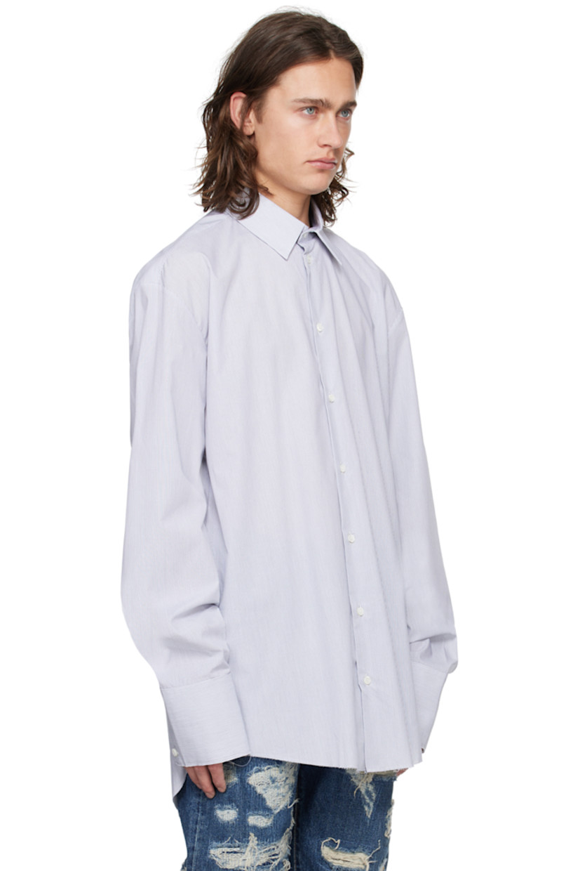 Cotton poplin shirt. Jacquard pinstripes throughout.

· Spread collar
· Concealed button closure
· Logo embroidered at front
· Raw edge at shirttail hem and cuffs
· Four-button extended barrel cuffs

Supplier color: Navy