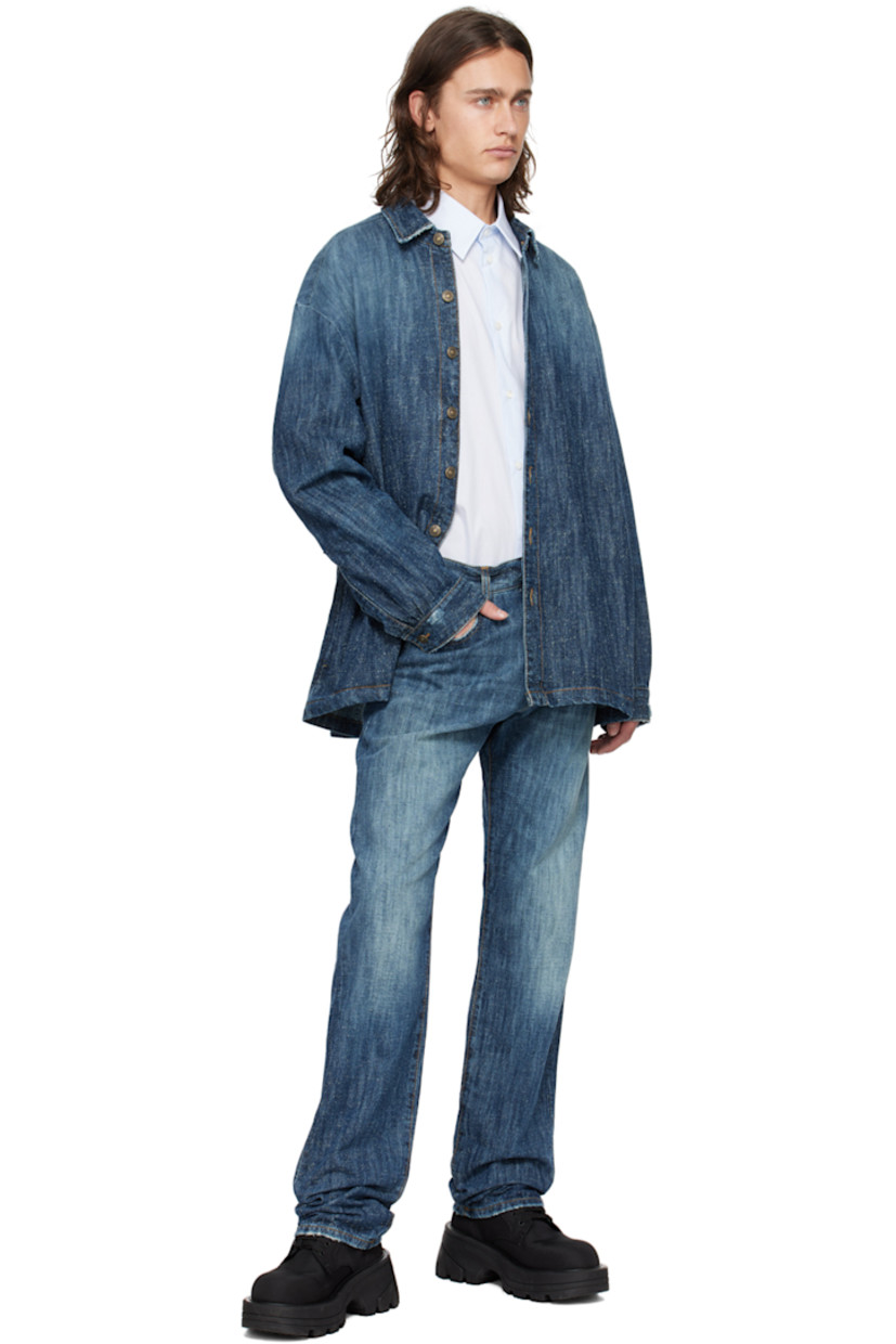 Hand-treated non-stretch denim shirt. Fading and subtle distressing throughout.

· Spread collar
· Button closure
· Seam pockets
· Dropped shoulders
· Single-button barrel cuffs
· Box pleat at back yoke
· Logo-engraved brass-tone hardware
· Contrast stitching in brown

Supplier color: Stone