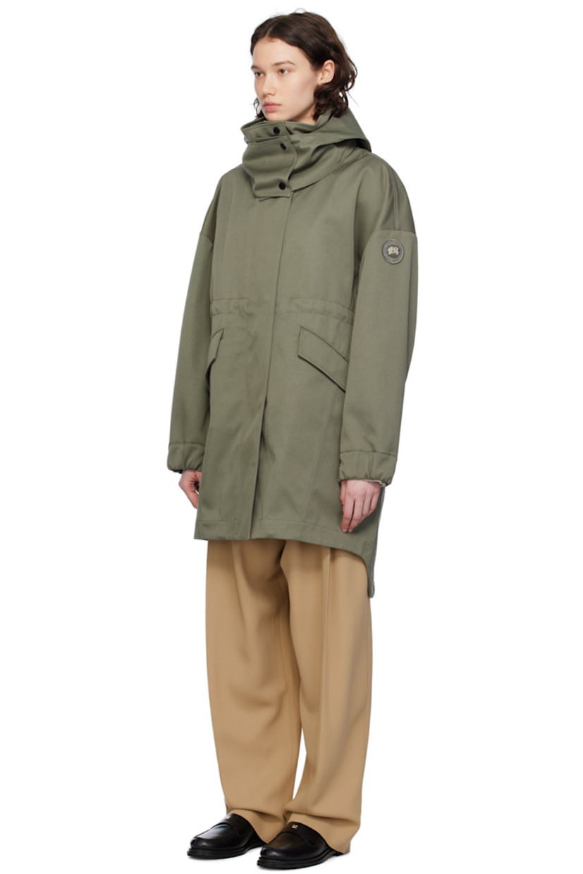 Polyester- and cotton-blend twill coat.

· Detachable hood at stand collar
· Two-way zip closure with press-stud placket
· Flap pockets
· Embroidered logo patch at sleeve
· Adjustable press-stud tab at elasticized cuffs
· Taped seams at interior
· Patch pockets at interior
· Bungee-style drawstring at interior waist
· Partial twill lining

Supplier color: Smokey sage