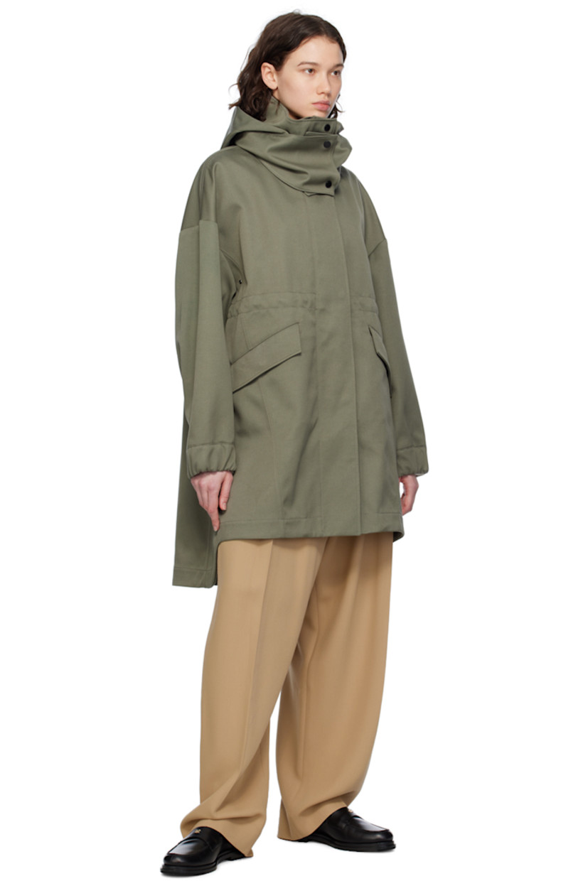 Polyester- and cotton-blend twill coat.

· Detachable hood at stand collar
· Two-way zip closure with press-stud placket
· Flap pockets
· Embroidered logo patch at sleeve
· Adjustable press-stud tab at elasticized cuffs
· Taped seams at interior
· Patch pockets at interior
· Bungee-style drawstring at interior waist
· Partial twill lining

Supplier color: Smokey sage
