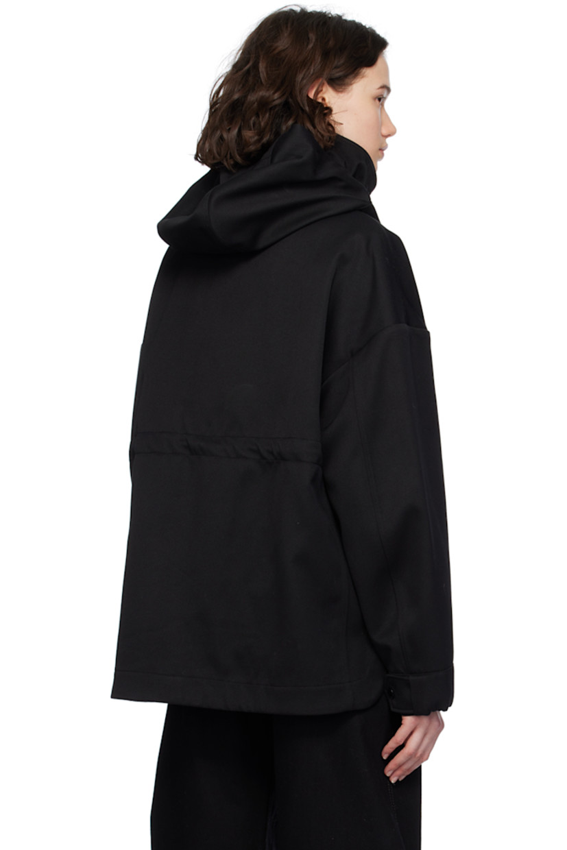 Polyester- and cotton-blend twill jacket.

· Detachable hood at stand collar
· Two-way zip closure with press-stud placket
· Flap pockets
· Droptail hem
· Metal eyelets at underarms
· Embroidered logo patch at sleeve
· Adjustable press-stud tab at elasticized cuffs
· Taped seams at interior
· Patch pockets at interior
· Bungee-style drawstring at interior waist
· Partial twill lining

Supplier color: Black