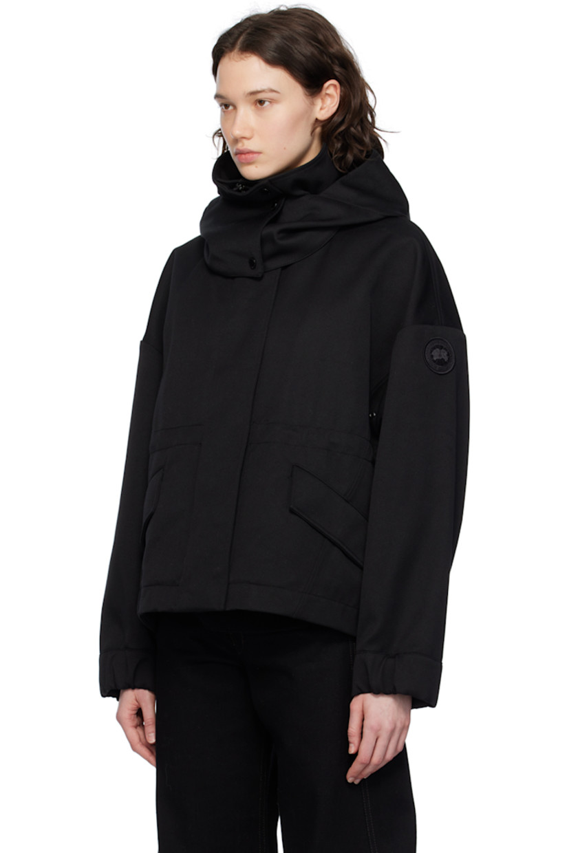 Polyester- and cotton-blend twill jacket.

· Detachable hood at stand collar
· Two-way zip closure with press-stud placket
· Flap pockets
· Droptail hem
· Metal eyelets at underarms
· Embroidered logo patch at sleeve
· Adjustable press-stud tab at elasticized cuffs
· Taped seams at interior
· Patch pockets at interior
· Bungee-style drawstring at interior waist
· Partial twill lining

Supplier color: Black