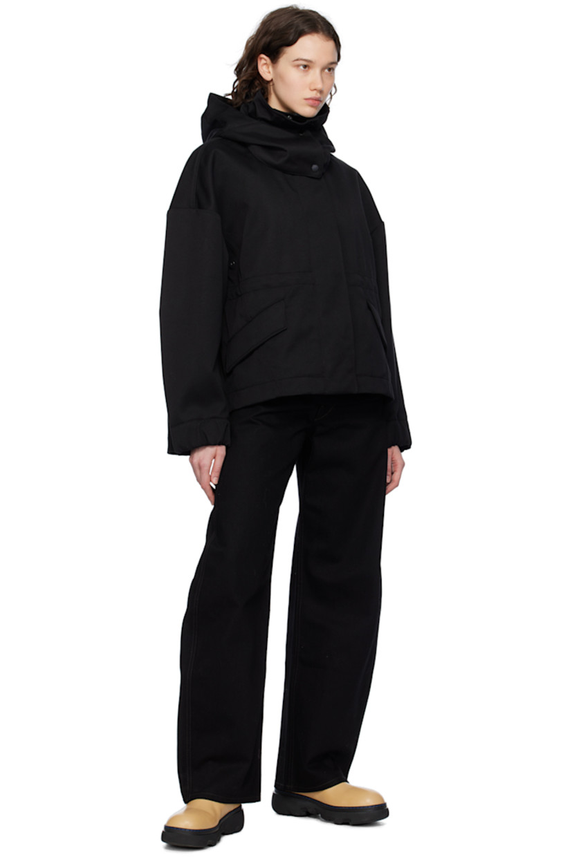 Polyester- and cotton-blend twill jacket.

· Detachable hood at stand collar
· Two-way zip closure with press-stud placket
· Flap pockets
· Droptail hem
· Metal eyelets at underarms
· Embroidered logo patch at sleeve
· Adjustable press-stud tab at elasticized cuffs
· Taped seams at interior
· Patch pockets at interior
· Bungee-style drawstring at interior waist
· Partial twill lining

Supplier color: Black