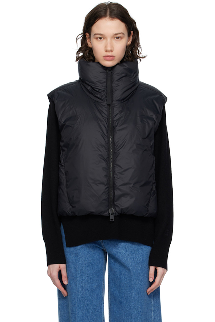 Down-filled nylon satin vest. Wind-resistant, water-repellent, and lightweight.

· Funnel neck
· Two-way zip closure
· Bungee-style drawstring at cropped hem
· Seam zip pockets
· Embroidered logo patch at back collar
· Full satin lining

Supplier color: Black

Fill: 90% duck down, 10% duck feather.