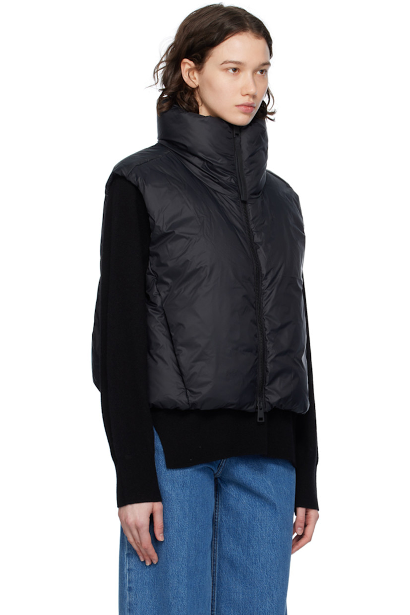 Down-filled nylon satin vest. Wind-resistant, water-repellent, and lightweight.

· Funnel neck
· Two-way zip closure
· Bungee-style drawstring at cropped hem
· Seam zip pockets
· Embroidered logo patch at back collar
· Full satin lining

Supplier color: Black

Fill: 90% duck down, 10% duck feather.
