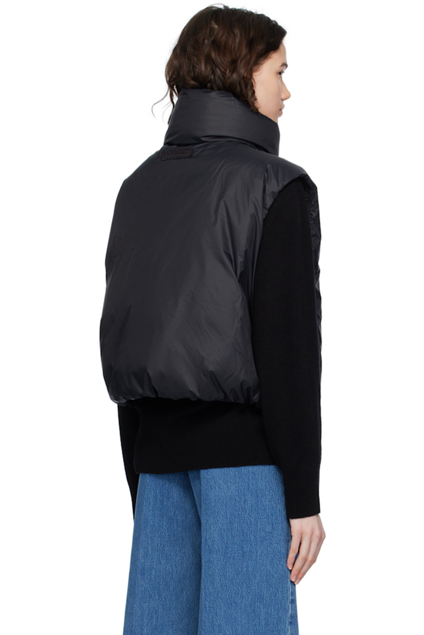 Down-filled nylon satin vest. Wind-resistant, water-repellent, and lightweight.

· Funnel neck
· Two-way zip closure
· Bungee-style drawstring at cropped hem
· Seam zip pockets
· Embroidered logo patch at back collar
· Full satin lining

Supplier color: Black

Fill: 90% duck down, 10% duck feather.
