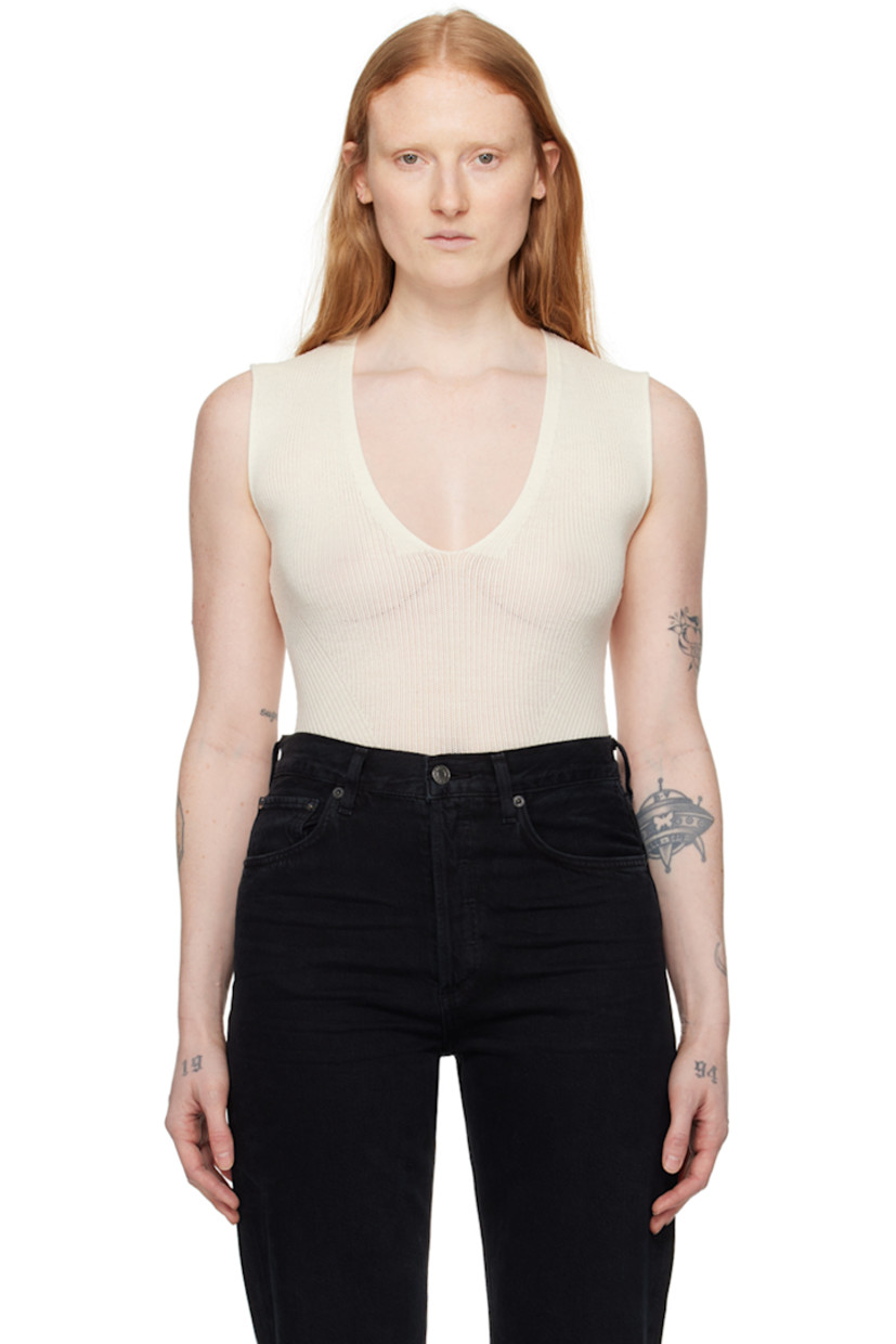 Semi-sheer knit and rib knit virgin wool bodysuit.

· Paneled construction
· Plunging V-neck
· Press-stud fastening at bottom
· Partial jersey lining

Supplier color: Ecrue