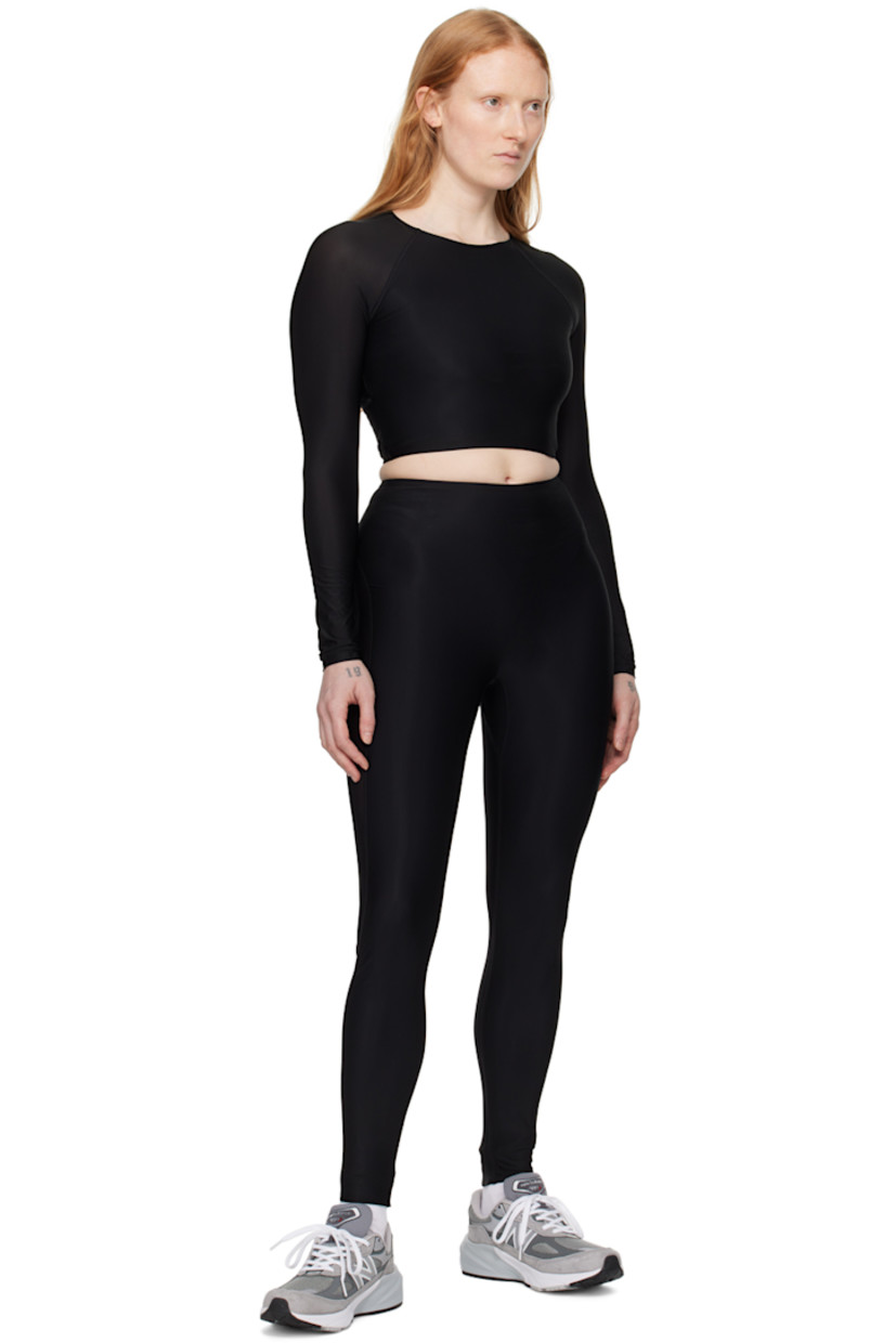 Quick-drying stretch nylon jersey and semi-sheer stretch nylon jersey top.

· Elasticized crewneck
· Cropped hem
· Raglan sleeves
· Logo printed at back collar
· Partially lined

Supplier color: Black