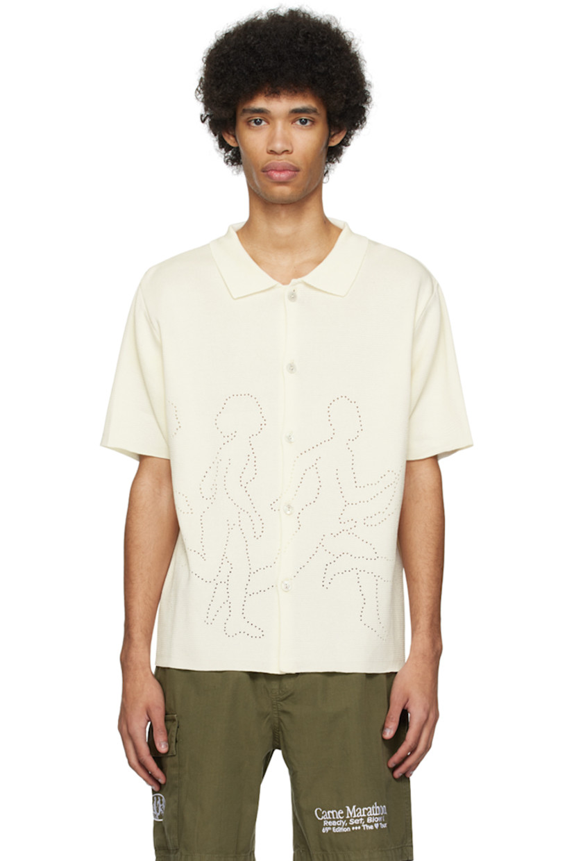 Knit mercerized organic cotton shirt.

· Rib knit spread collar
· Button closure
· Graphics perforated at front and back
· Mother-of-pearl hardware

Supplier color: Cream