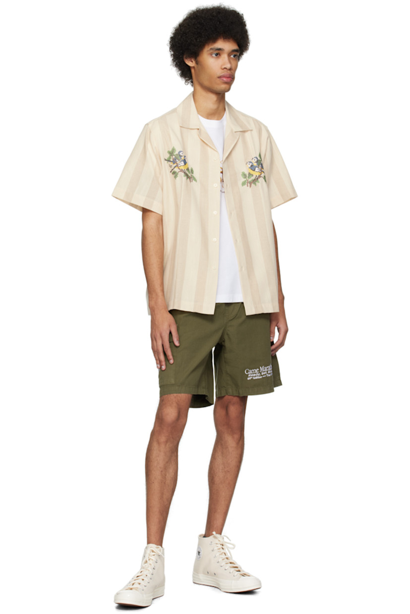 Cotton ripstop shorts.

· Concealed drawstring at elasticized waistband
· Three-pocket styling
· Mock-fly
· Text embroidered at front
· Flap pocket and embroidered graphic at outseam

Supplier color: Khaki