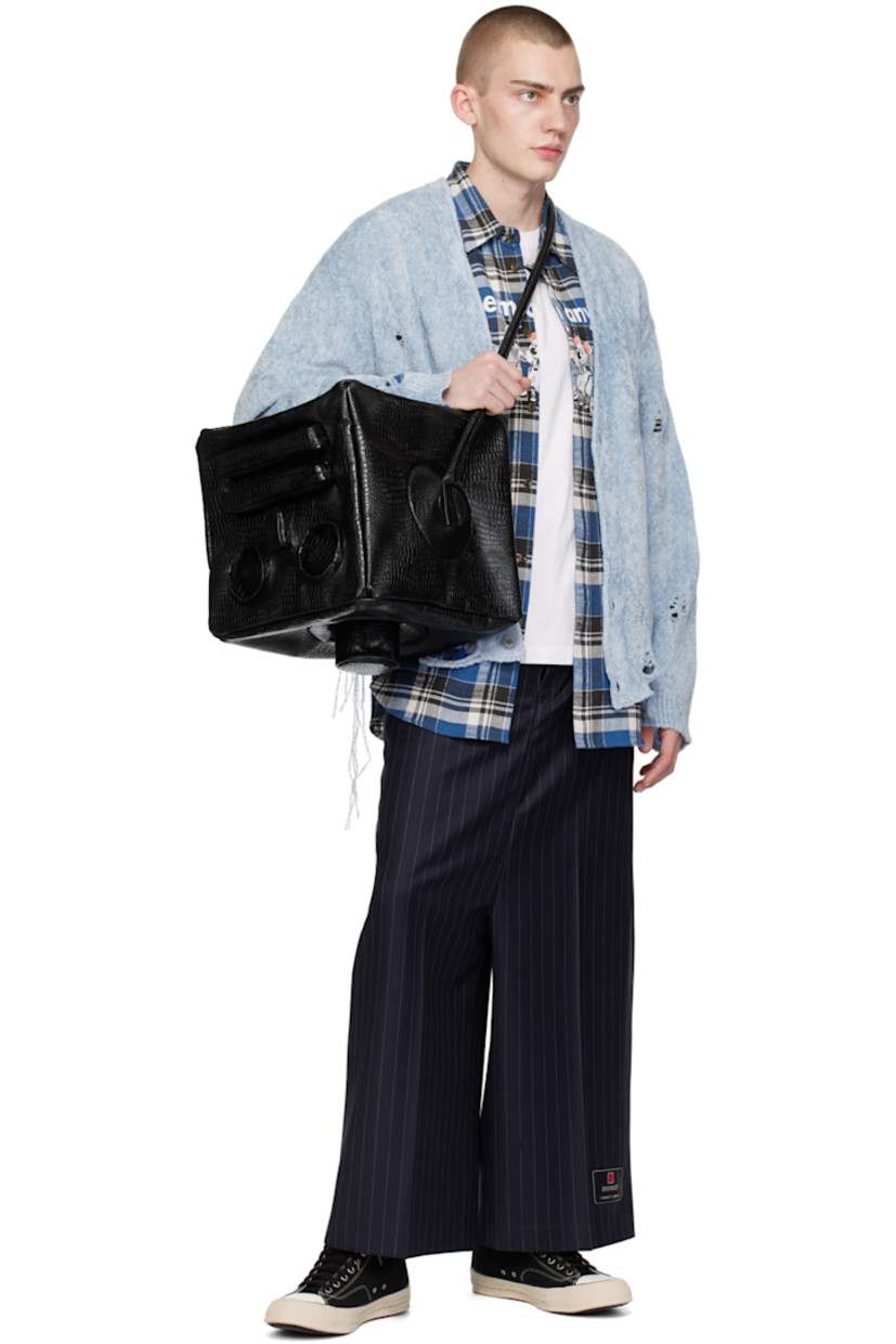 Wool gabardine trousers. Pinstripes throughout.

· Belt loops
· Four-pocket styling
· Zip-fly
· Central creases at front and back
· Logo patch at cuff

This item is part of a limited run of 20.

Supplier color: Black