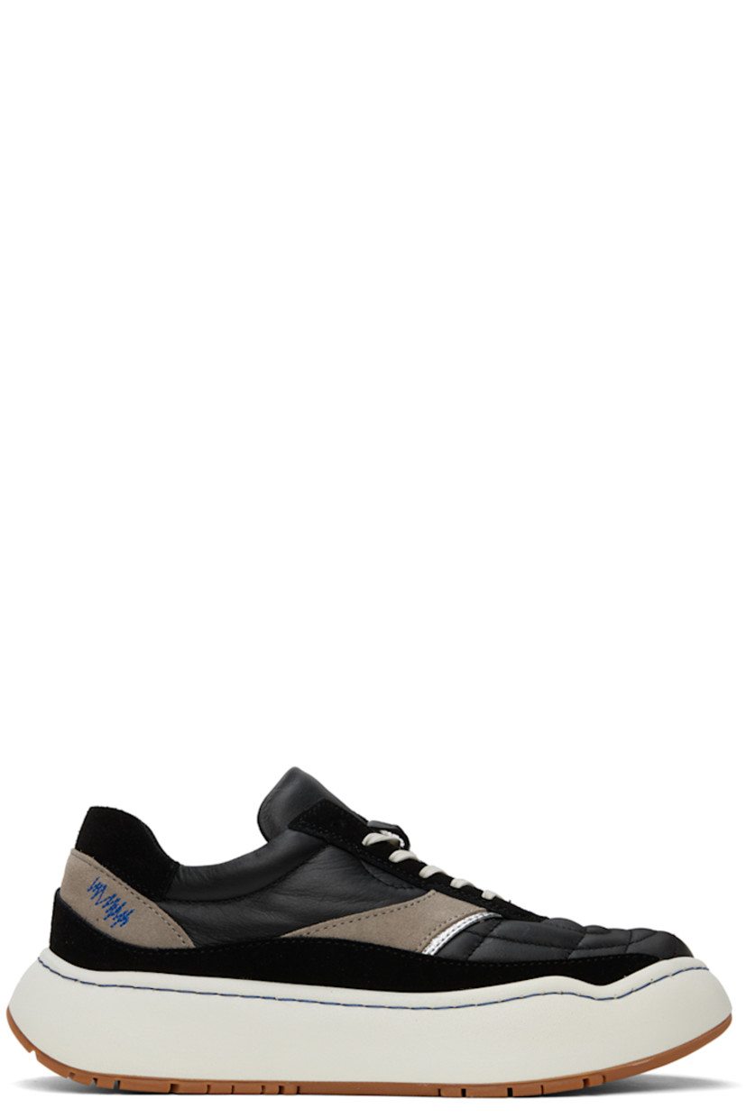 Low-top quilted grained leather and suede sneakers in black.

· Topstitching at vamp and welt
· Lace-up closure
· Padded tongue and collar
· Silver-tone leather trim at sides
· Logo embroidered at outer side
· Foam rubber platform midsole
· Treaded rubber sole
· Platform: H2"

Supplier color: Noir
