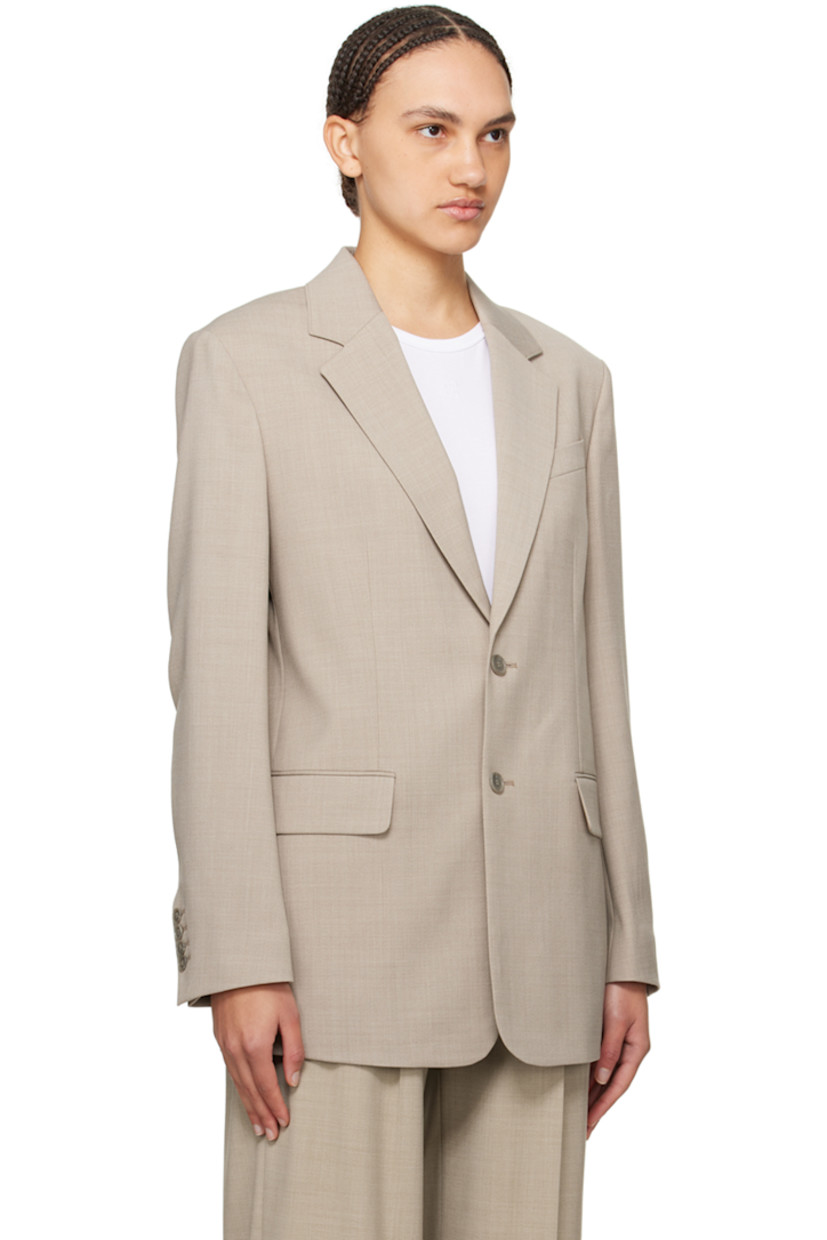 Stretch polyester- and wool-blend hopsack blazer.

· Notched lapel
· Two-button closure
· Welt pocket at chest
· Flap pockets
· Four-button surgeon's cuffs
· Central vent at back hem
· Welt pocket at interior
· Full satin lining
· Horn hardware

Supplier color: Sage melange