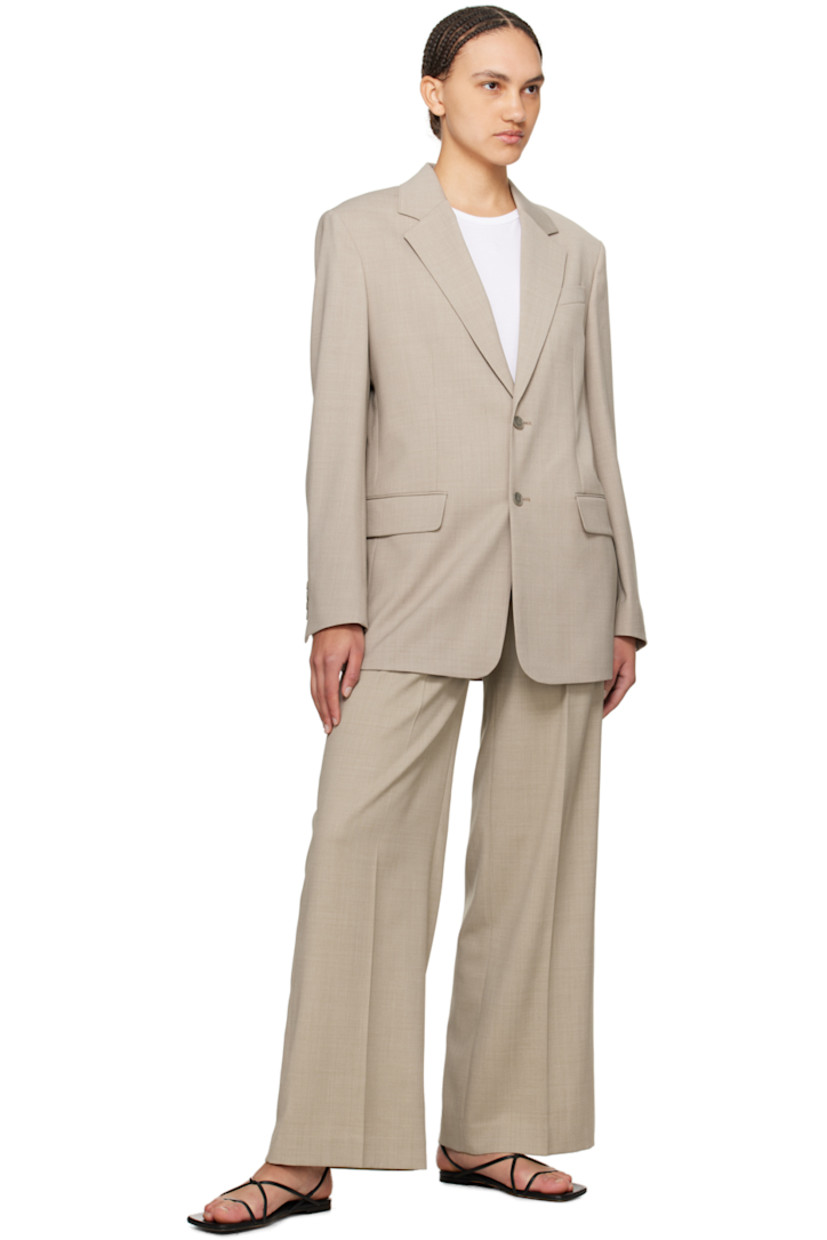 Stretch polyester- and wool-blend hopsack blazer.

· Notched lapel
· Two-button closure
· Welt pocket at chest
· Flap pockets
· Four-button surgeon's cuffs
· Central vent at back hem
· Welt pocket at interior
· Full satin lining
· Horn hardware

Supplier color: Sage melange