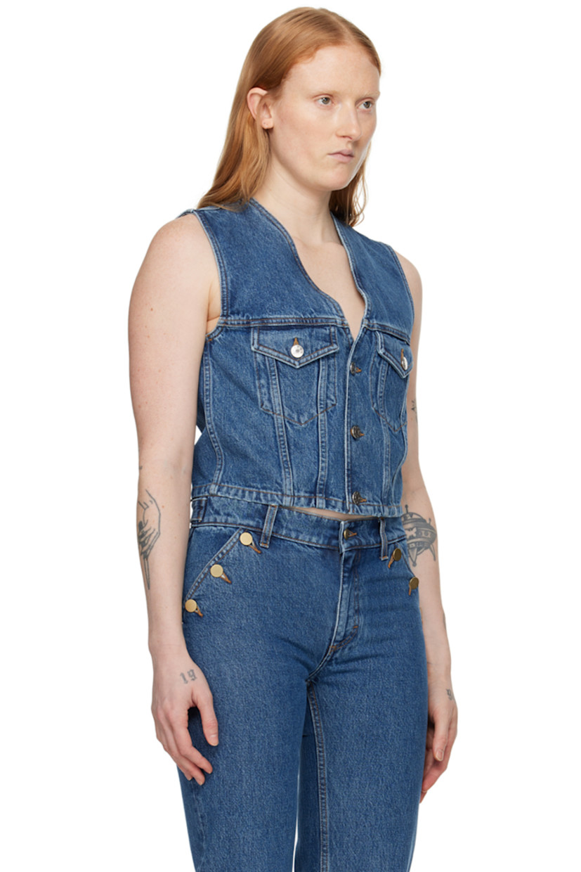Non-stretch TENCEL™ lyocell-blend denim vest. Fading and subtle distressing throughout.

· Y-neck
· Button closure
· Flap pockets
· Cropped hem
· Logo-engraved silver-tone hardware
· Contrast stitching in tan

Supplier color: Washed mid blue