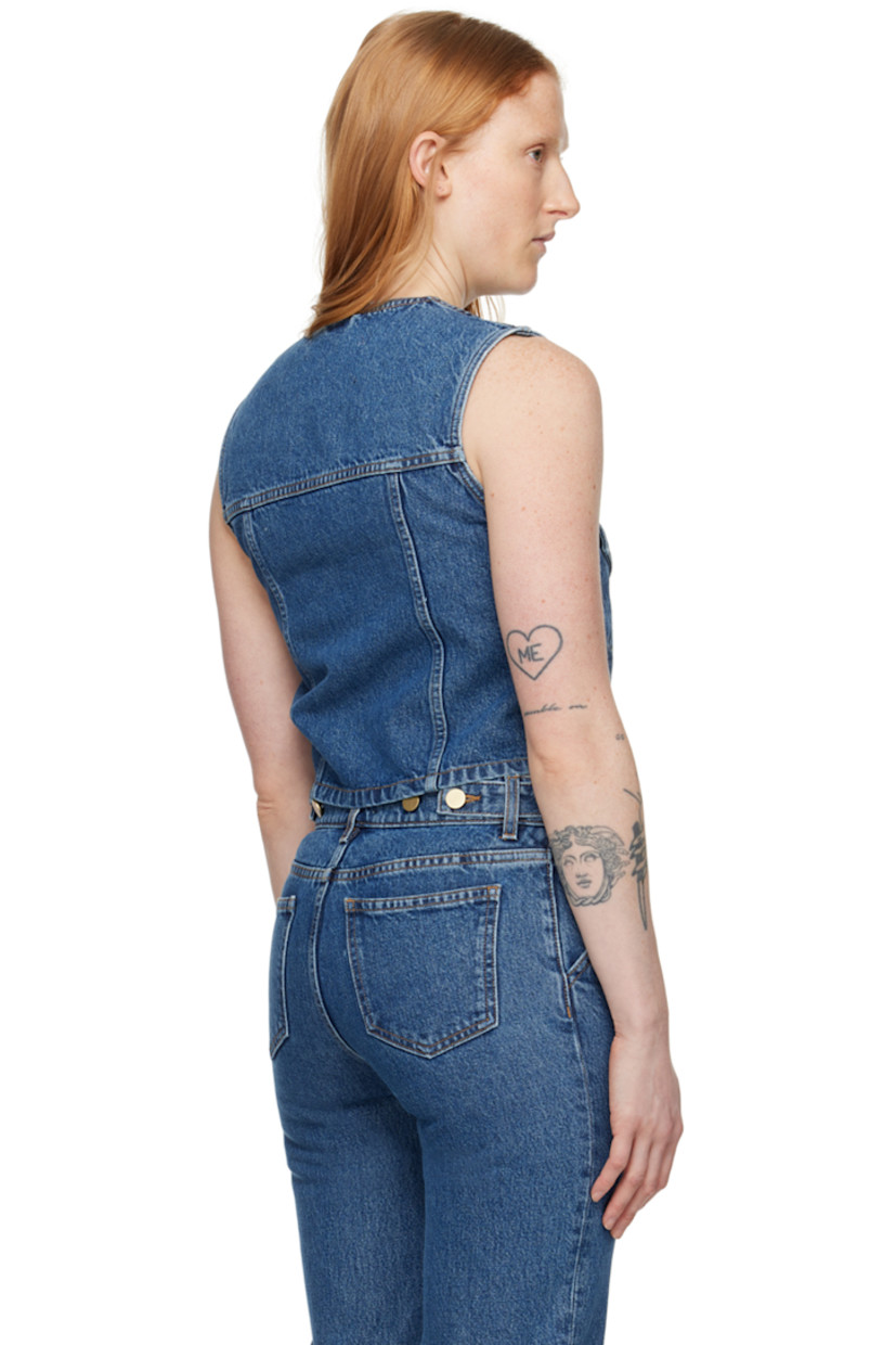 Non-stretch TENCEL™ lyocell-blend denim vest. Fading and subtle distressing throughout.

· Y-neck
· Button closure
· Flap pockets
· Cropped hem
· Logo-engraved silver-tone hardware
· Contrast stitching in tan

Supplier color: Washed mid blue