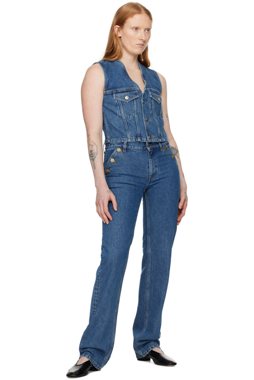 Slim-fit non-stretch TENCEL™ lyocell-blend denim jeans. Subtle fading throughout.

· Low-rise
· Belt loops
· Four-pocket styling
· Zip-fly
· Button fastening at front pockets 
· Adjustable button tabs at back waistband 

Supplier color: Washed mid blue