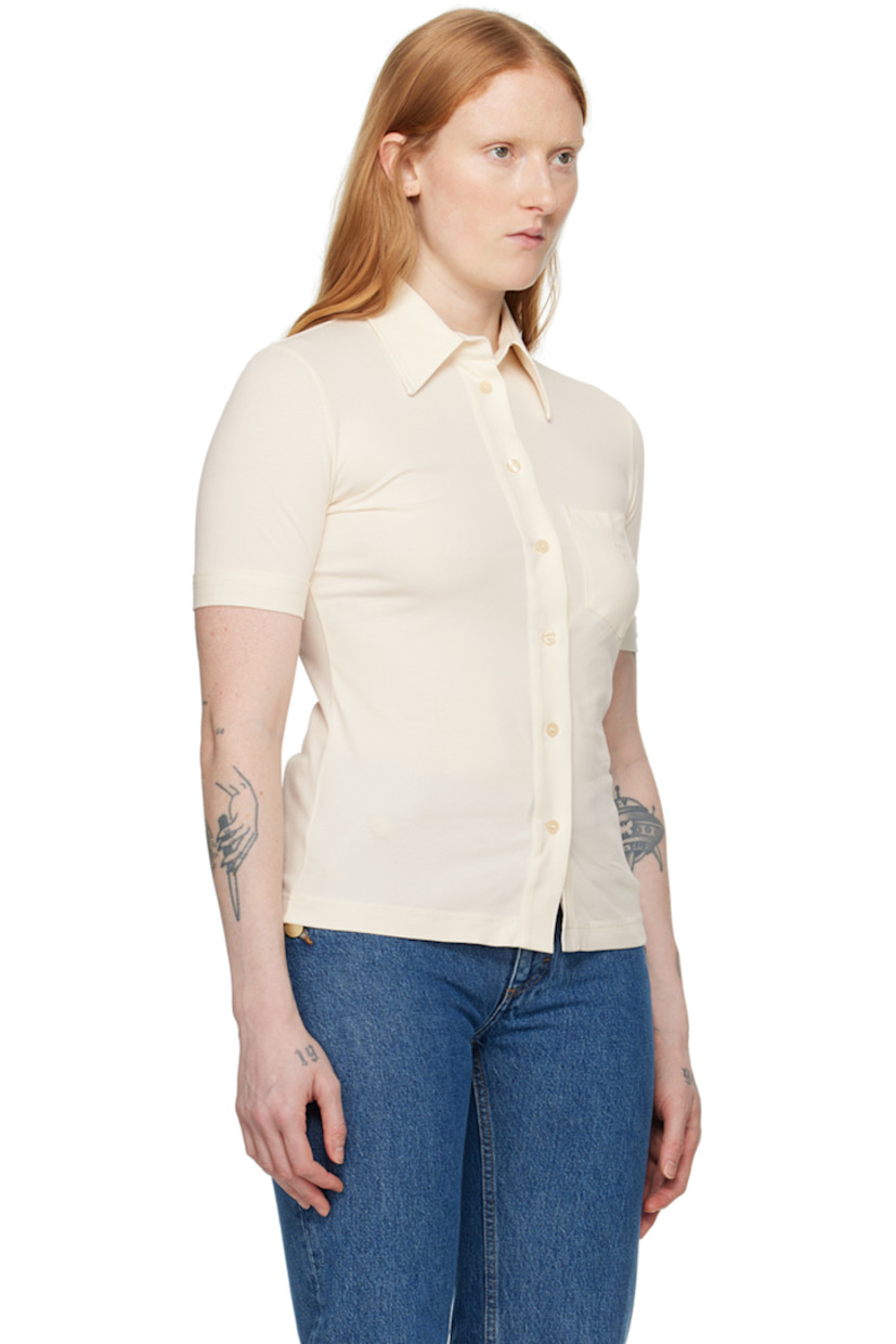 Stretch organic cotton jersey shirt. 

· Spread collar 
· Button closure 
· Text embroidered at patch pocket 
· Rolled cuffs

Part of the 1993 collection.

Supplier color: Ivory
