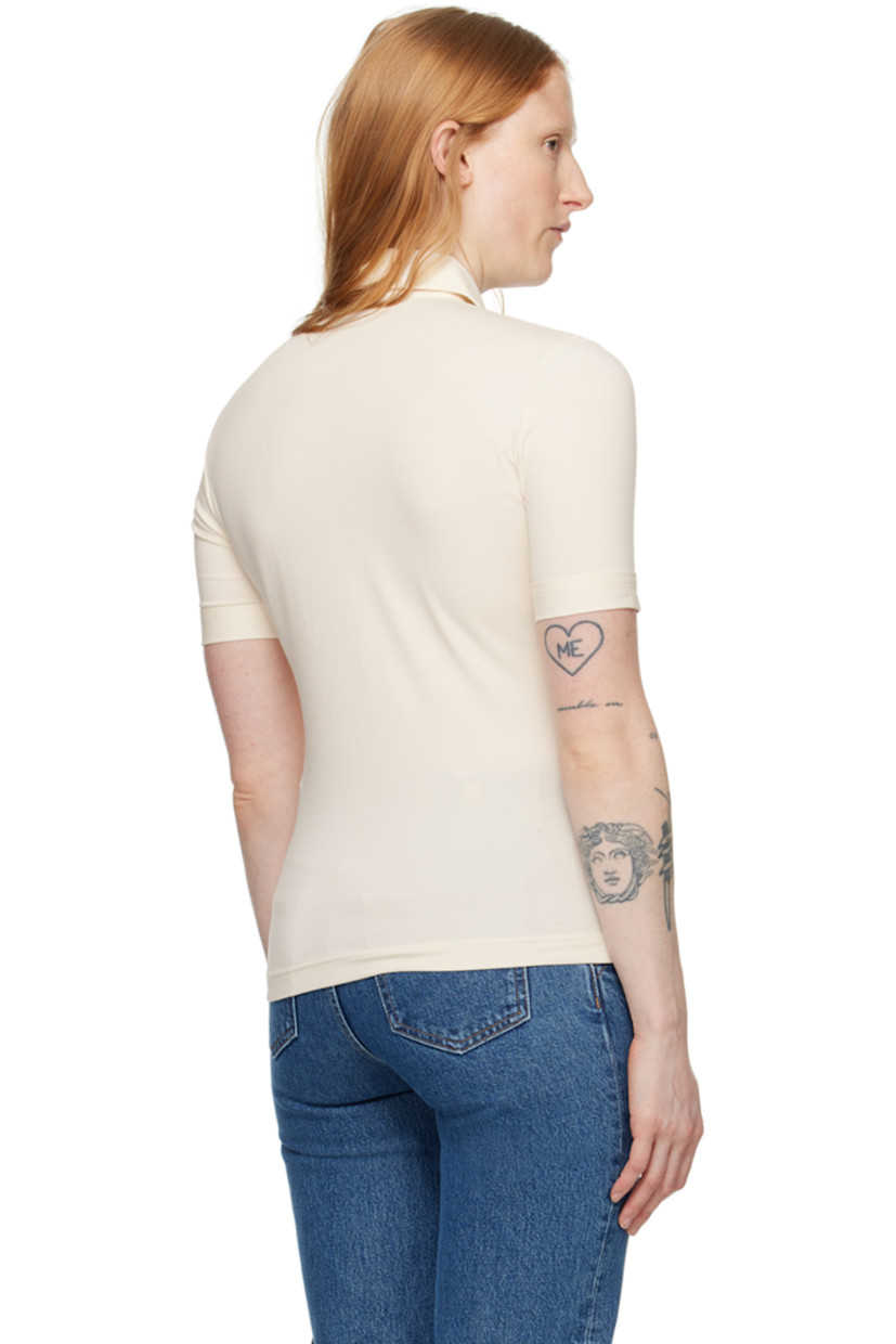 Stretch organic cotton jersey shirt. 

· Spread collar 
· Button closure 
· Text embroidered at patch pocket 
· Rolled cuffs

Part of the 1993 collection.

Supplier color: Ivory