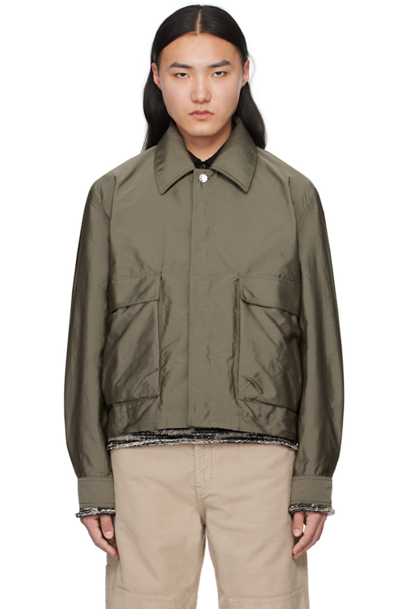 Lightweight polyester faille jacket.

· Spread collar
· Concealed button closure
· Flap pockets
· Concealed bungee-style drawstring at hem
· Single-button barrel cuffs
· Logo embroidered at back collar
· Full satin lining
· Logo-engraved silver-tone hardware

Supplier color: Dark sage