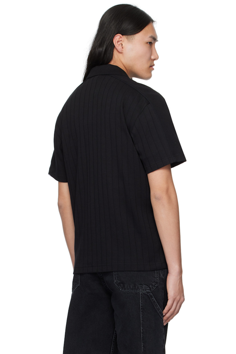 Organic cotton jersey shirt. Stripes throughout. 

· Spread collar
· Button closure
· Embroidered logo patch at chest
· Yoke sleeves

Supplier color: Black