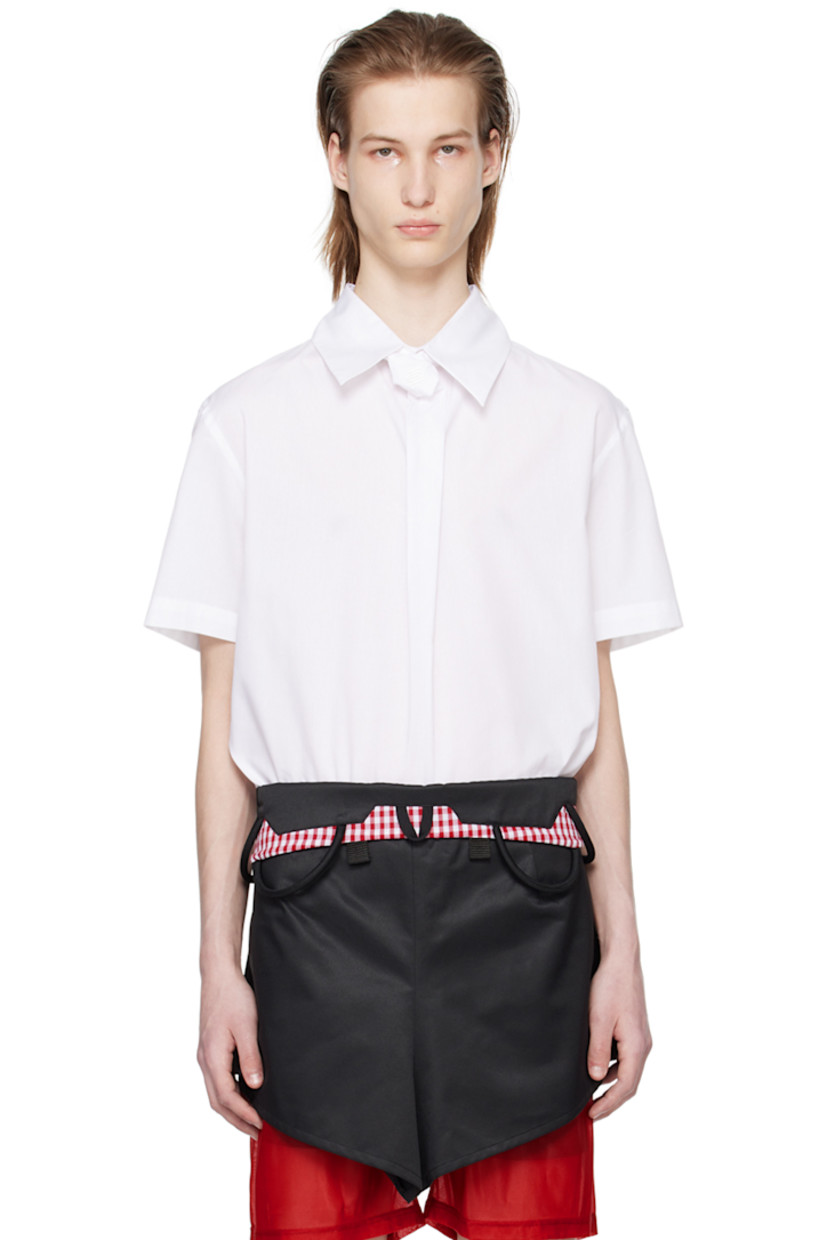 Cotton poplin shirt. 

· Logo-embroidered tie-style trim at spread collar 
· Box pleat at front 
· Vented back collar
· Zip closure and pleats at back

Supplier color: White