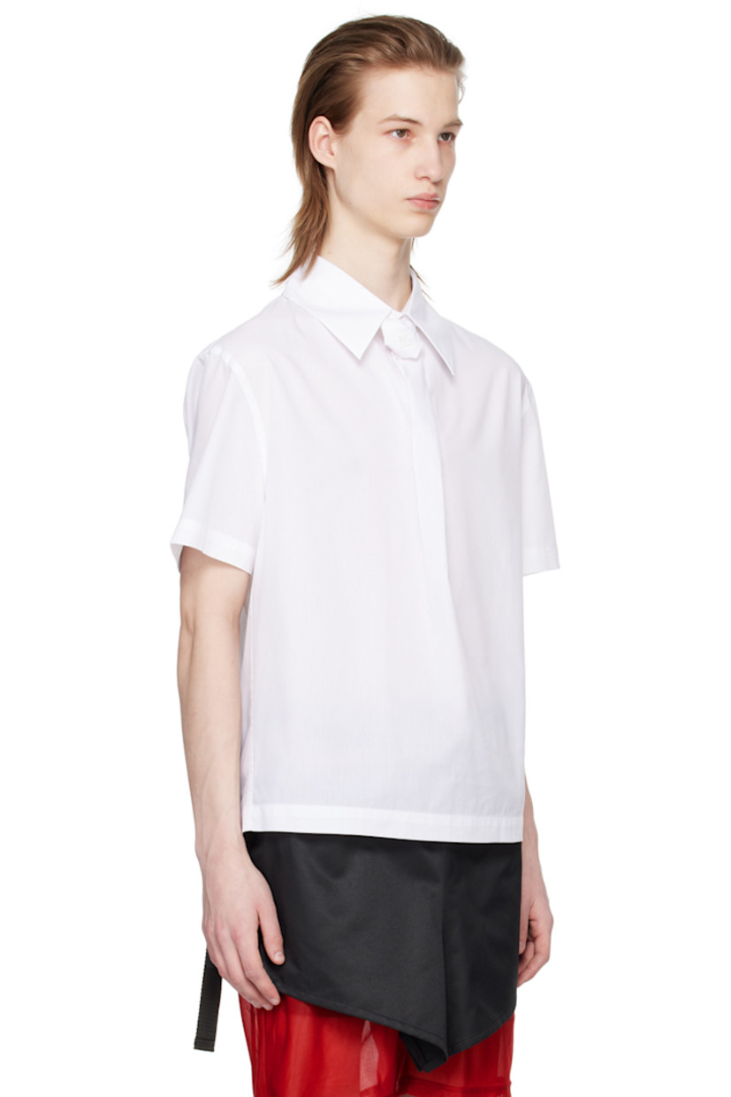 Cotton poplin shirt. 

· Logo-embroidered tie-style trim at spread collar 
· Box pleat at front 
· Vented back collar
· Zip closure and pleats at back

Supplier color: White