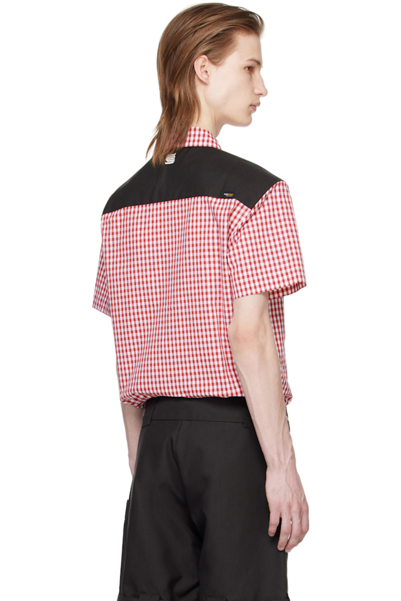 Cotton-blend poplin shirt. Gingham pattern throughout. 

· Spread collar 
· Button closure 
· Patch pocket 
· Canvas panel at shoulders and back yoke
· Logo embroidered at back collar
· Logo flag at back yoke

Supplier color: Red gingham/Black