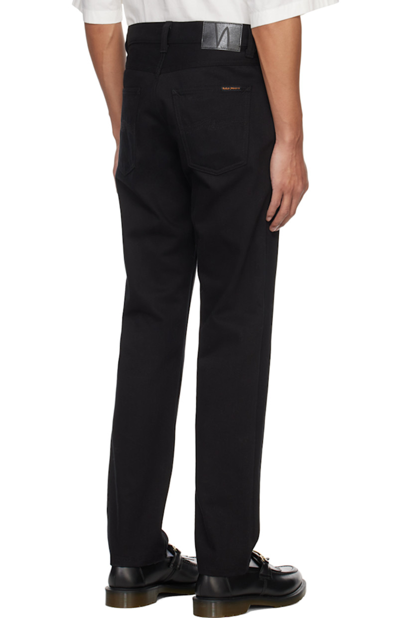 Slim-fit tapered stretch 12 oz organic cotton denim jeans. GOTS-, FSC-, and GRS-certified.

· Belt loops
· Five-pocket styling
· Zip-fly
· Jacron logo patch at back waistband
· Logo flag at back pocket
· Logo-engraved antiqued silver-tone hardware

Supplier color: Dry everblack