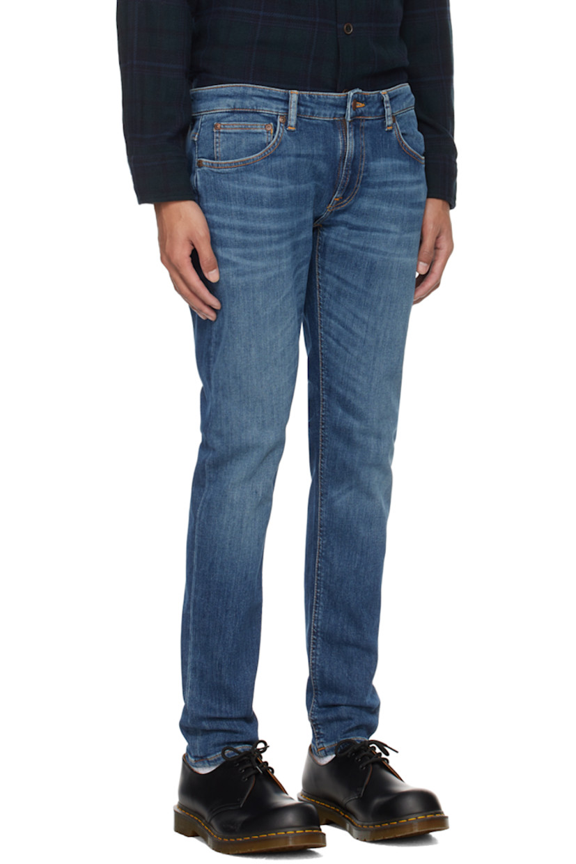 Skinny-fit stretch 12.5 oz organic cotton denim jeans. Fading and whiskering throughout. 

· GOTS-, FSC-, and GRS-certified
· Low-rise
· Belt loops
· Five-pocket styling
· Zip-fly
· Jacron logo patch at back waistband
· Logo flag at back pocket
· Logo-engraved antiqued copper-tone hardware
· Contrast stitching in orange

Supplier color: Dark blue navy