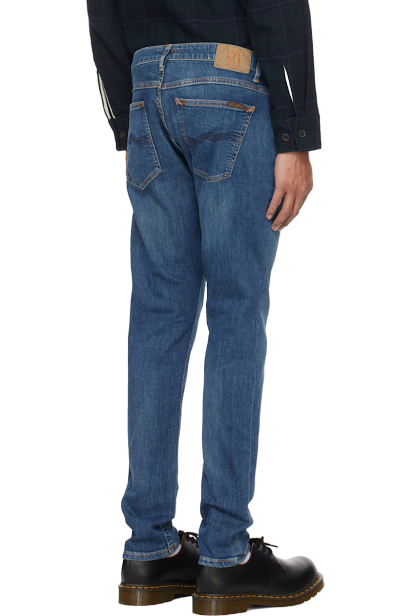 Skinny-fit stretch 12.5 oz organic cotton denim jeans. Fading and whiskering throughout. 

· GOTS-, FSC-, and GRS-certified
· Low-rise
· Belt loops
· Five-pocket styling
· Zip-fly
· Jacron logo patch at back waistband
· Logo flag at back pocket
· Logo-engraved antiqued copper-tone hardware
· Contrast stitching in orange

Supplier color: Dark blue navy