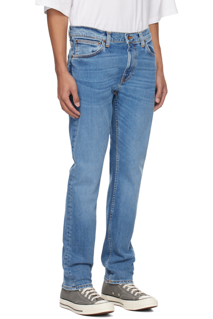 Slim-fit tapered 12.5 oz stretch organic cotton denim jeans. Fading and whiskering throughout. 

· GOTS-, FSC-, and GRS-certified
· Belt loops
· Five-pocket styling
· Zip-fly
· Jacron logo patch at back waistband
· Logo flag at back pocket
· Logo-engraved antiqued copper-tone hardware
· Contrast stitching in orange

Supplier color: Lost orange