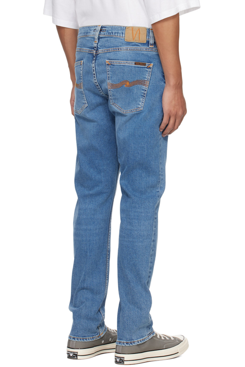 Slim-fit tapered 12.5 oz stretch organic cotton denim jeans. Fading and whiskering throughout. 

· GOTS-, FSC-, and GRS-certified
· Belt loops
· Five-pocket styling
· Zip-fly
· Jacron logo patch at back waistband
· Logo flag at back pocket
· Logo-engraved antiqued copper-tone hardware
· Contrast stitching in orange

Supplier color: Lost orange