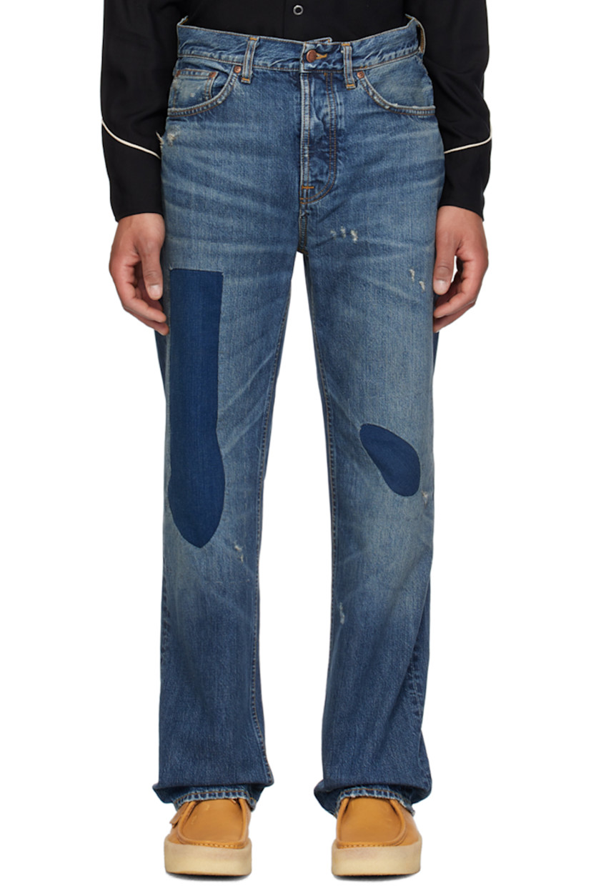 Wide-leg 14.2 oz non-stretch denim jeans. Fading, whiskering, and distressing throughout.

· High-rise
· Belt loops
· Five-pocket styling
· Button-fly
· Patchwork at front
· Logo patch at back waistband and pocket
· Contrast stitching in orange

Supplier color: Patch work