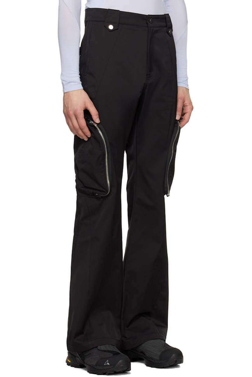 Flared polyester- and cotton-blend twill cargo pants. Webbing trim throughout.

· Press-stud tabs at front waistband
· Four-pocket styling
· Zip-fly
· Zip pocket at outseams
· Belt loops at back waistband
· Strap with hinged-post fastening at back

Supplier color: Black
