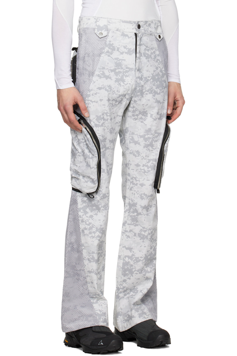 Flared polyester mesh and plain-woven cotton cargo pants. Camouflage pattern and webbing trim throughout.

· Press-stud tabs at front waistband
· Four-pocket styling
· Zip-fly
· Zip pocket at outseams
· Belt loops at back waistband
· Strap with hinged-post fastening at back

Available exclusively at SSENSE.

Supplier color: Snow camo/Mesh