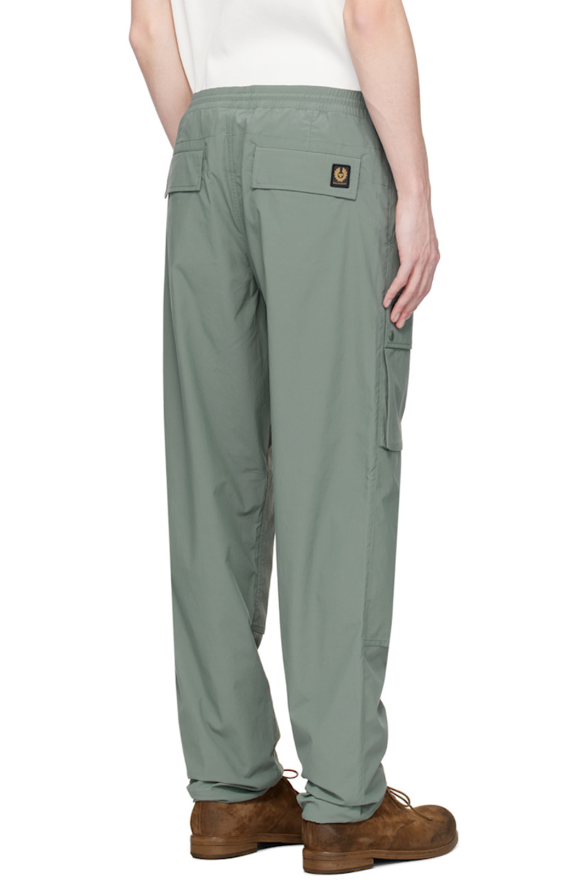 Relaxed-fit polyester taffeta trousers. Water-repellent, quick-drying, and UV protection.

· Bungee-style drawstring at elasticized waistband 
· Four-pocket styling 
· Zip-fly
· Logo patch at front and back
· Reinforced panel at knees
· Concealed bungee-style drawstring at cuffs
· Bellows pocket at outseams
· Unlined

Supplier color: Mineral green