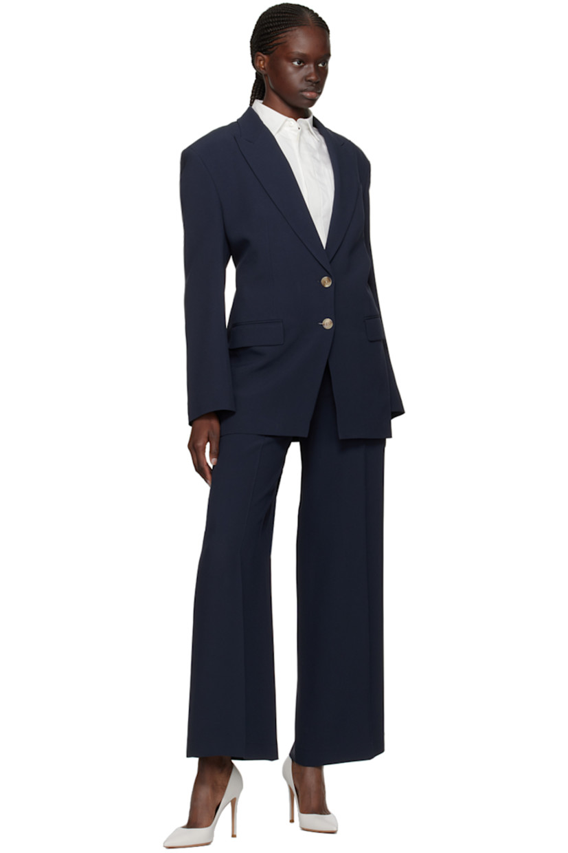 Plain-woven acetate- and viscose-blend blazer.

· Notched lapel
· Two-button closure
· Welt pocket
· Darts at waist
· Flap pockets
· Padded shoulders
· Adjustable cinch strap and cutout at back
· Partially elasticized back waistband
· Partial satin lining

Supplier color: Dark blue