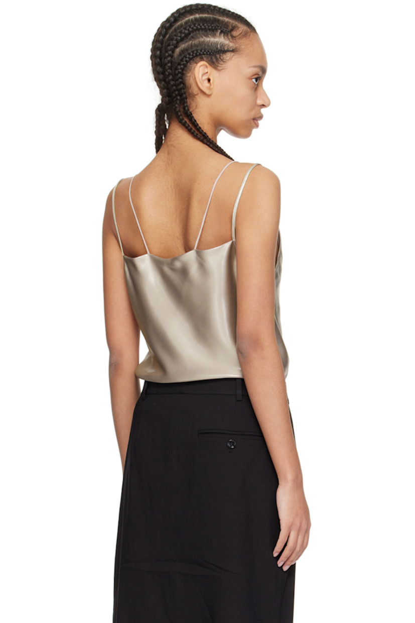 Polyester- and recycled polyester-blend satin camisole. Metallic thread detailing throughout.

· Layered construction
· Plunging V-neck
· Fixed spaghetti straps

Supplier color: Open beige