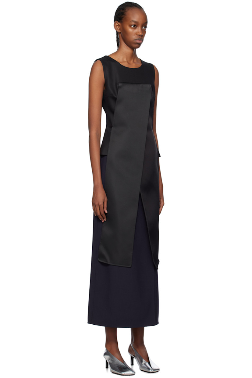 Stretch silk twill blouse. 

· Layered construction
· Round neck
· Darts at chest
· Offset vent extends from hem to chest
· Zip closure at back collar

Supplier color: Black