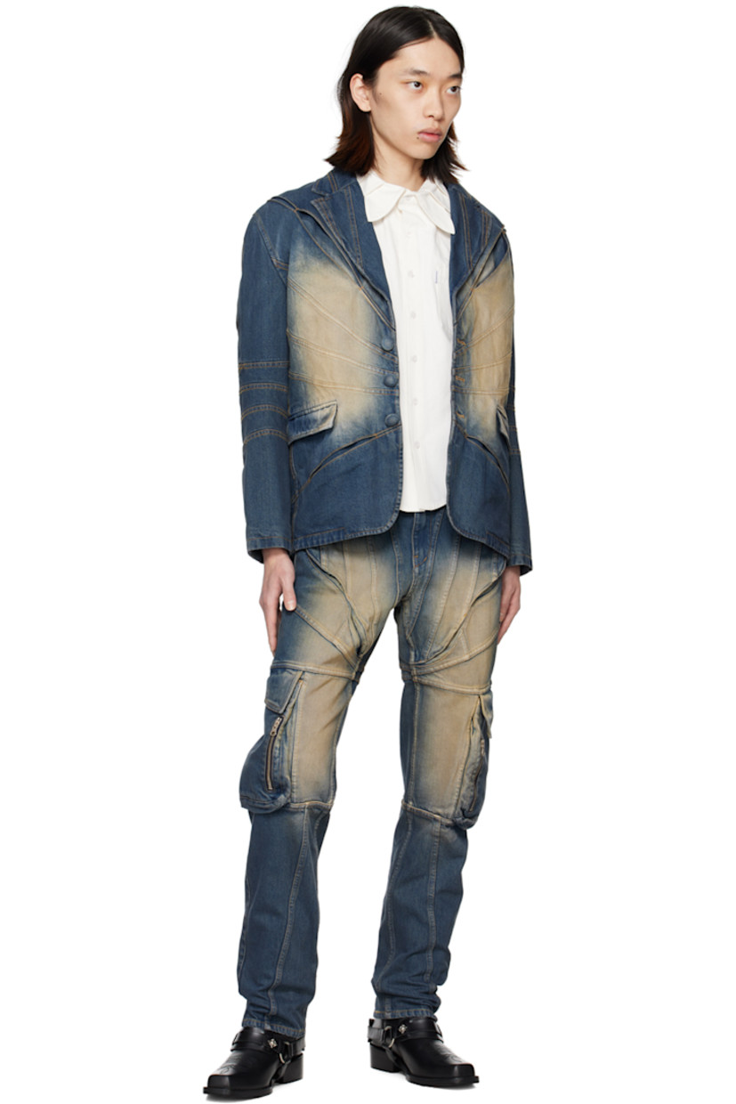 Non-stretch denim jeans. Fading throughout.

· Paneled construction
· Belt loops
· Four-pocket styling
· Zip-fly
· Panel and inverted pleats at front
· Cargo and zip pocket at outseams
· Leather logo patch at back waistband
· Logo flag at back pocket
· Contrast stitching in orange
 
Supplier color: Washed blue