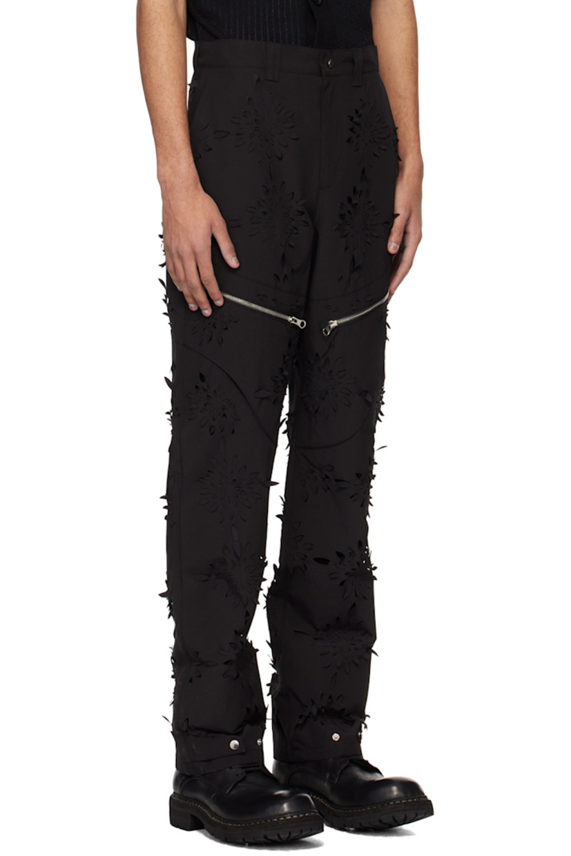 Polyester- and cotton-blend canvas trousers. Laser-cut floral detailing throughout.

· Paneled construction
· Belt loops
· Four-pocket styling
· Zip-fly
· Zip pocket at front legs
· Adjustable press-stud tab at cuffs
· Full polyester taffeta lining

Supplier color: Black