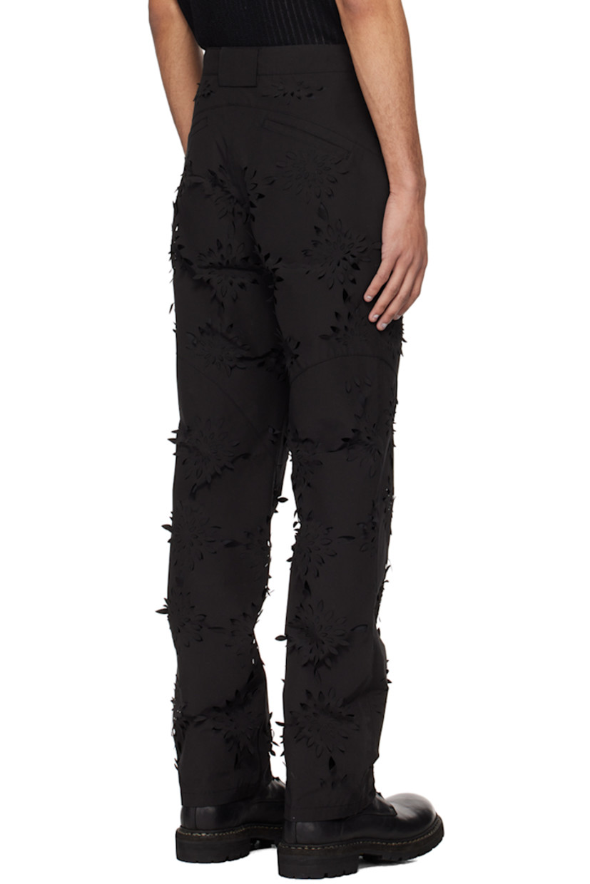 Polyester- and cotton-blend canvas trousers. Laser-cut floral detailing throughout.

· Paneled construction
· Belt loops
· Four-pocket styling
· Zip-fly
· Zip pocket at front legs
· Adjustable press-stud tab at cuffs
· Full polyester taffeta lining

Supplier color: Black