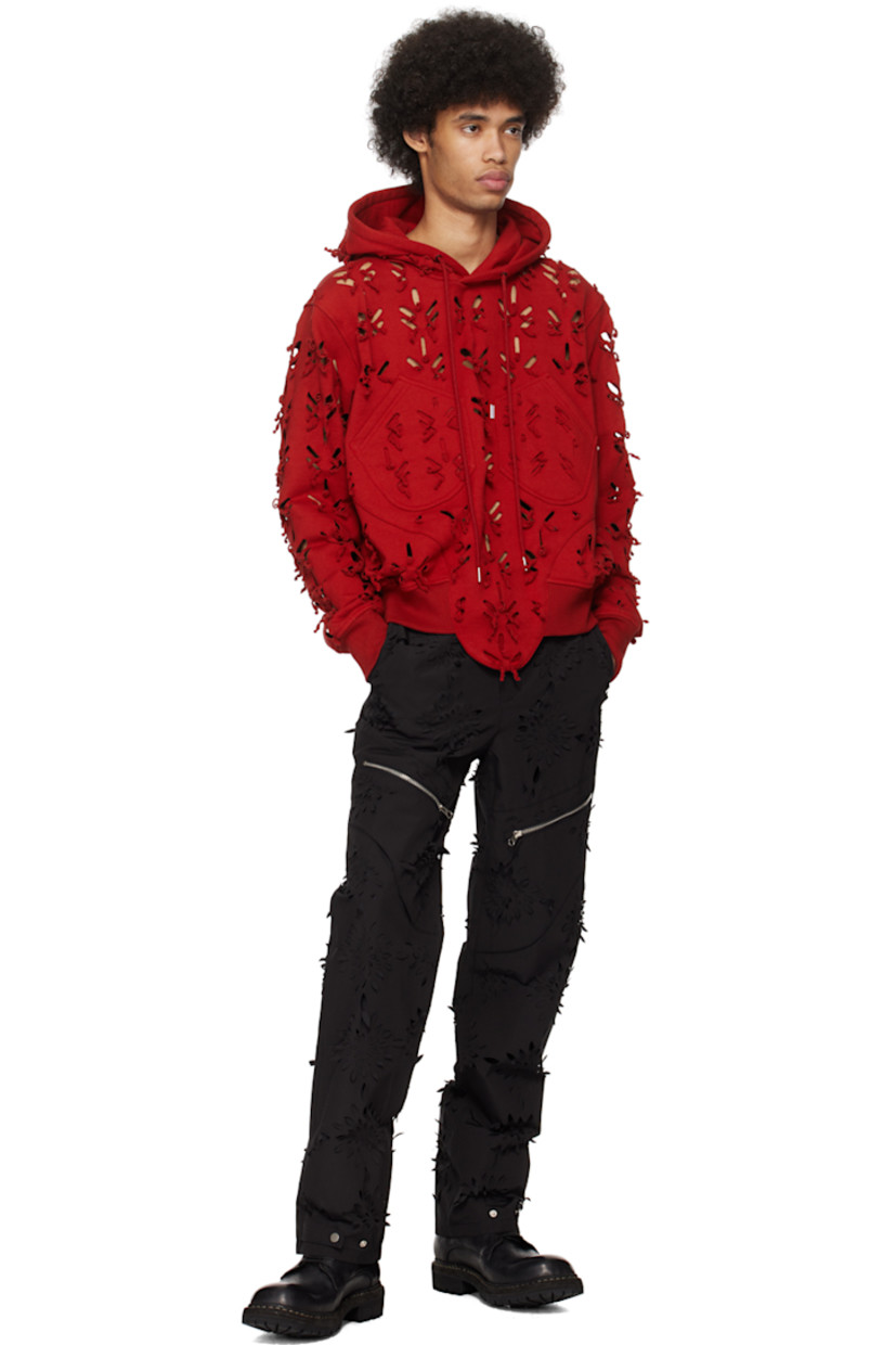 Polyester- and cotton-blend canvas trousers. Laser-cut floral detailing throughout.

· Paneled construction
· Belt loops
· Four-pocket styling
· Zip-fly
· Zip pocket at front legs
· Adjustable press-stud tab at cuffs
· Full polyester taffeta lining

Supplier color: Black