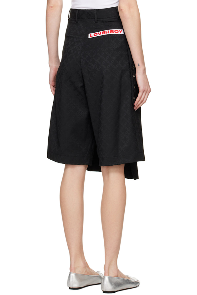 Stretch recycled polyester- and viscose-blend twill skort. Jacquard graphic pattern throughout.

· Layered construction
· Belt loops
· Three-pocket styling
· Zip-fly
· Pin-buckle fastening at pleated skirt-style overlay
· Logo patch at back

Supplier color: Black jacquard